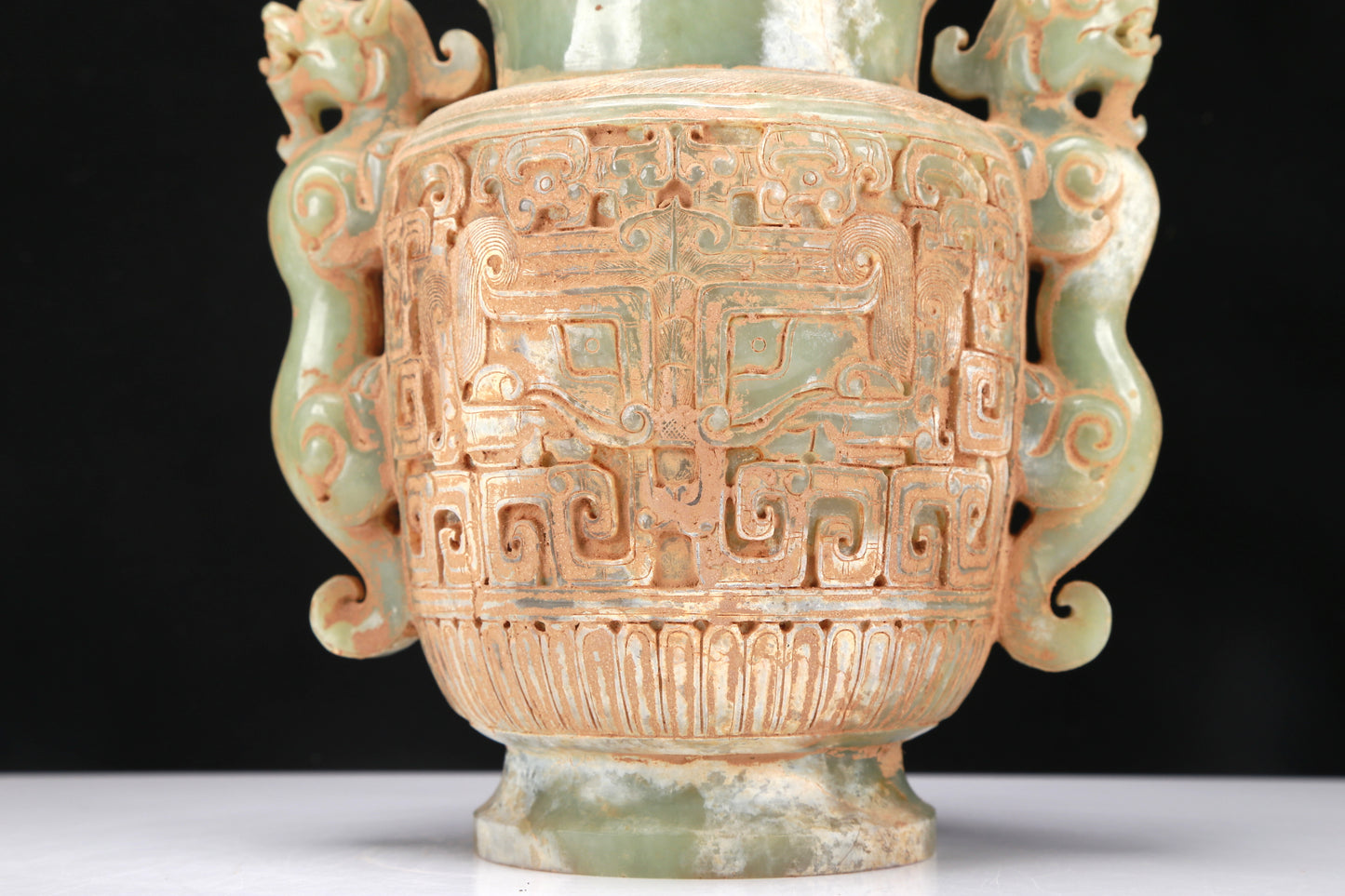 An Archaic Celadon-White Jade 'Animal Mask' Dragon-Handled Vase And Cover