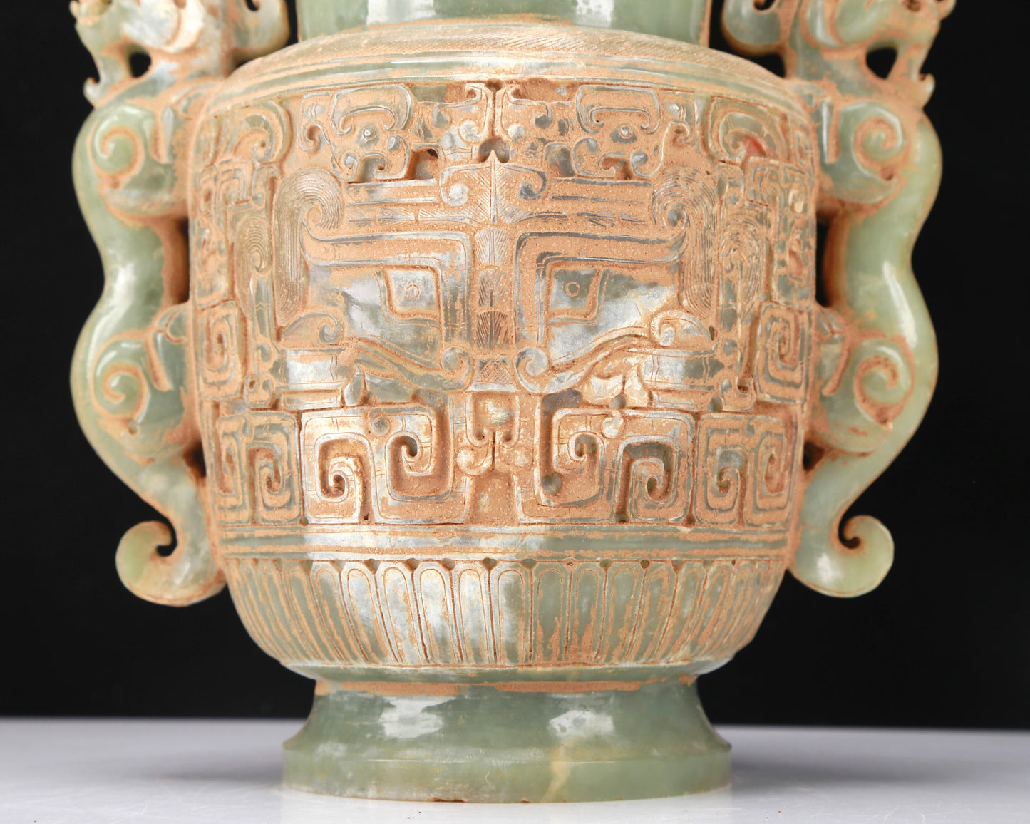 An Archaic Celadon-White Jade 'Animal Mask' Dragon-Handled Vase And Cover