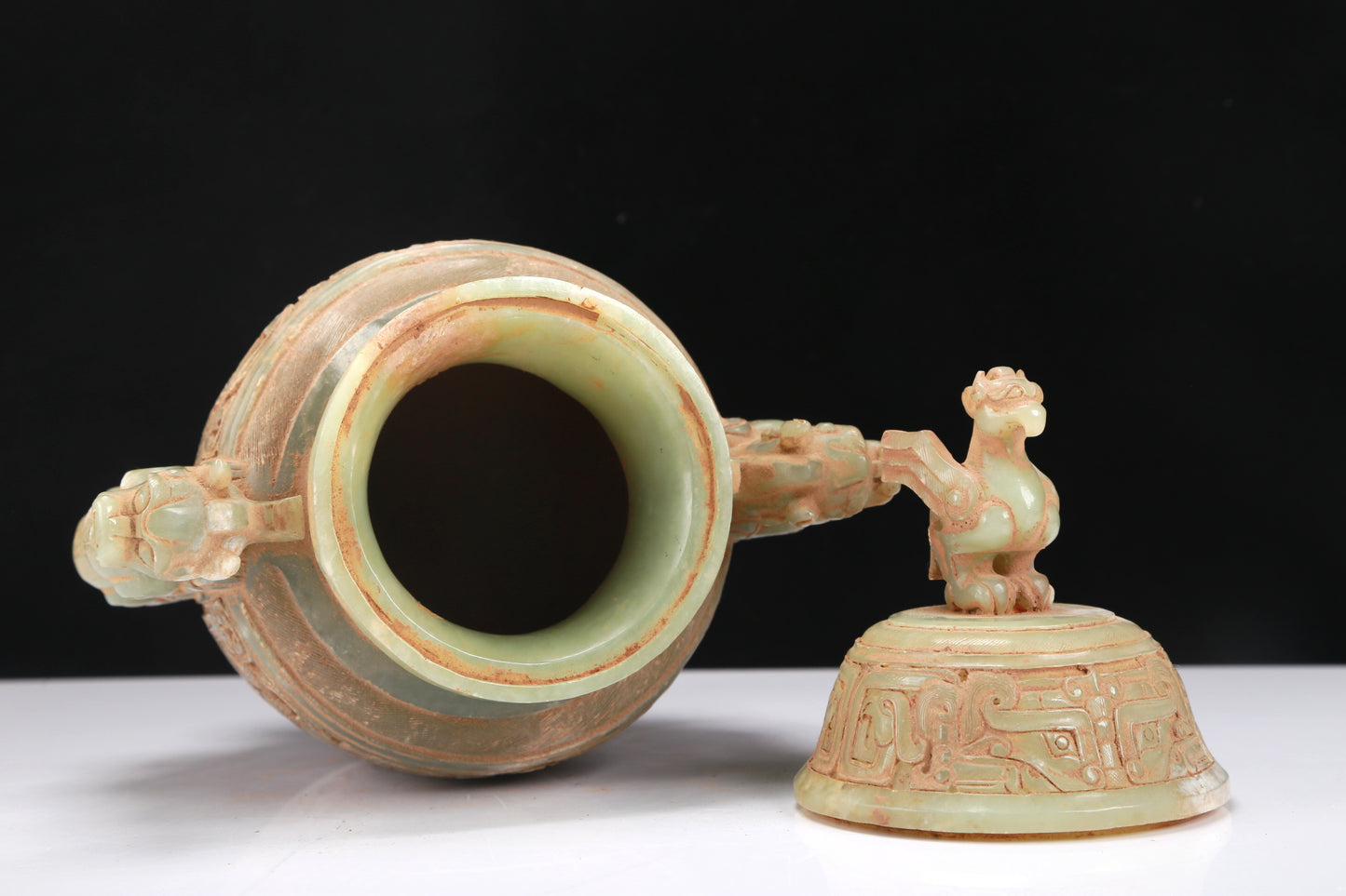 An Archaic Celadon-White Jade 'Animal Mask' Dragon-Handled Vase And Cover