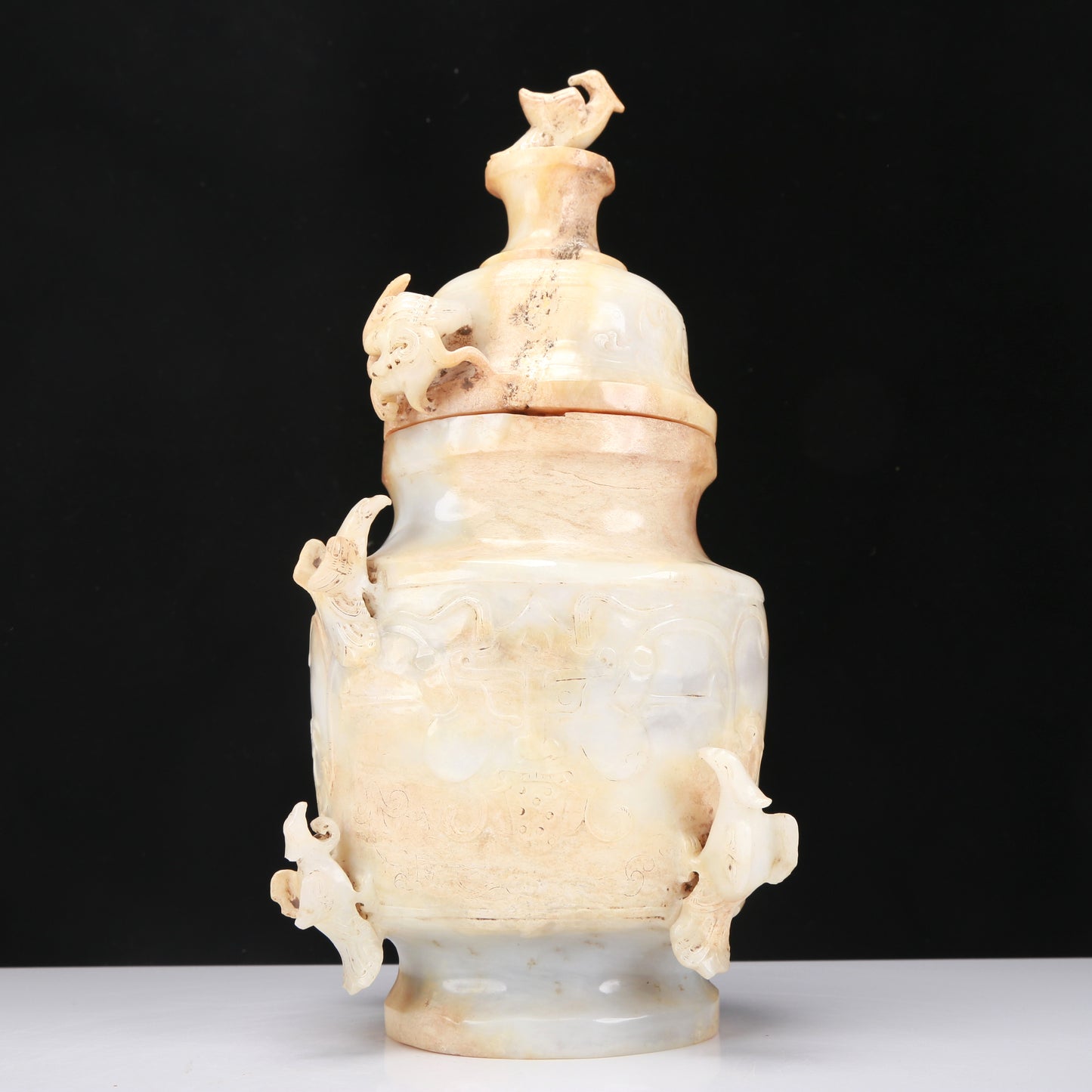 An Archaic White Jade 'Bird' Vase And Cover