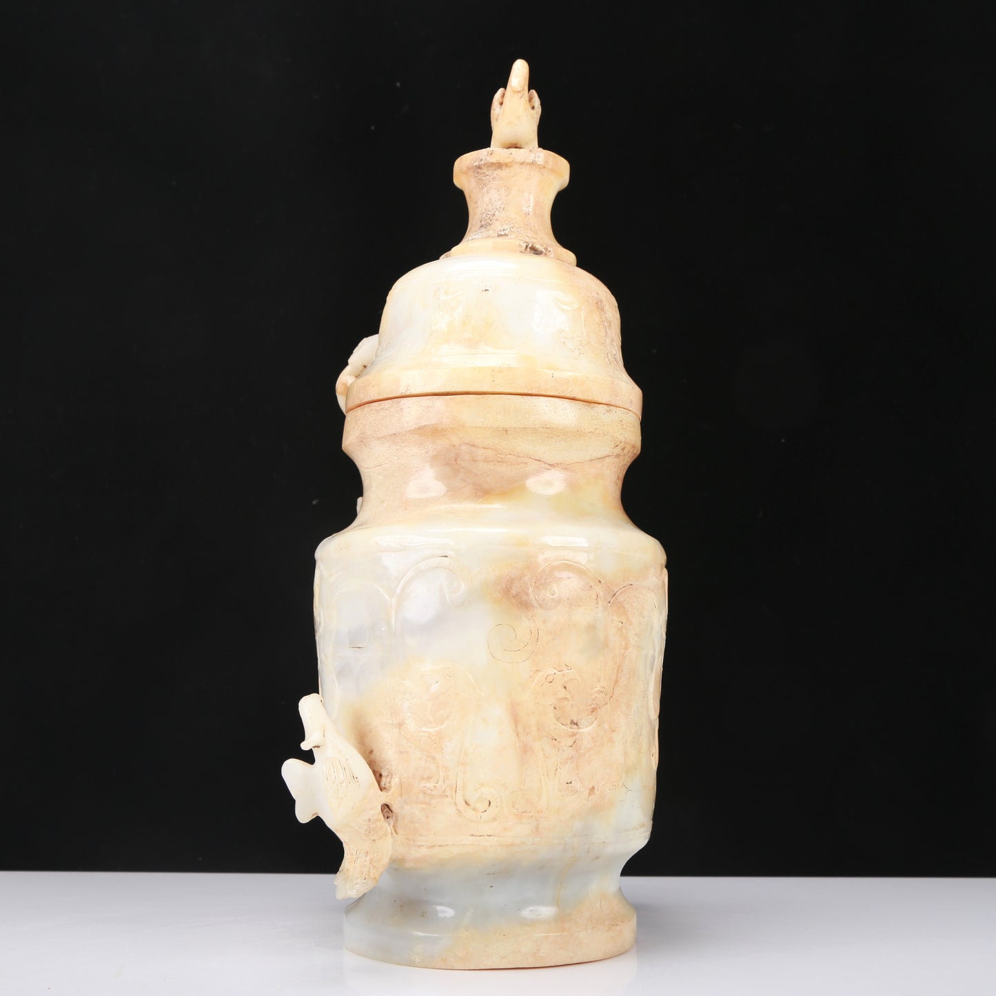 An Archaic White Jade 'Bird' Vase And Cover