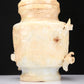 An Archaic White Jade 'Bird' Vase And Cover