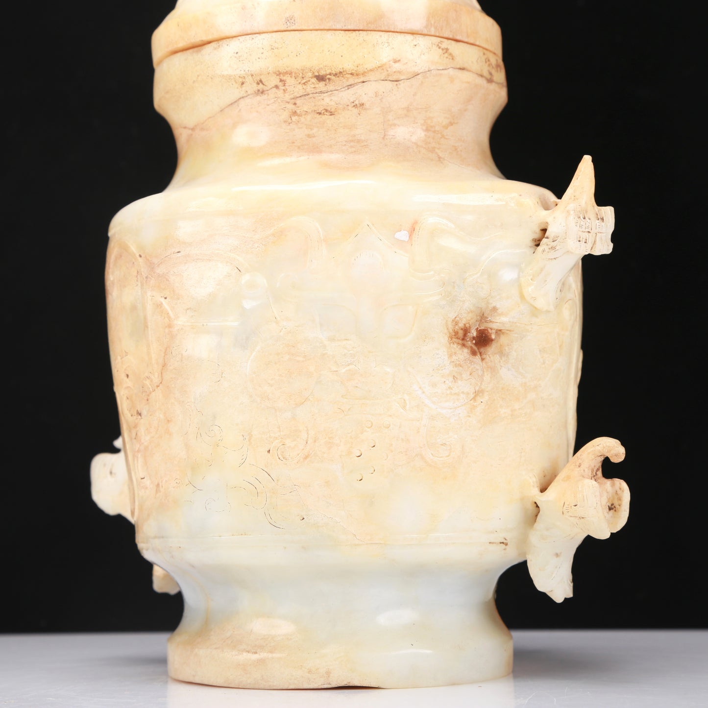 An Archaic White Jade 'Bird' Vase And Cover