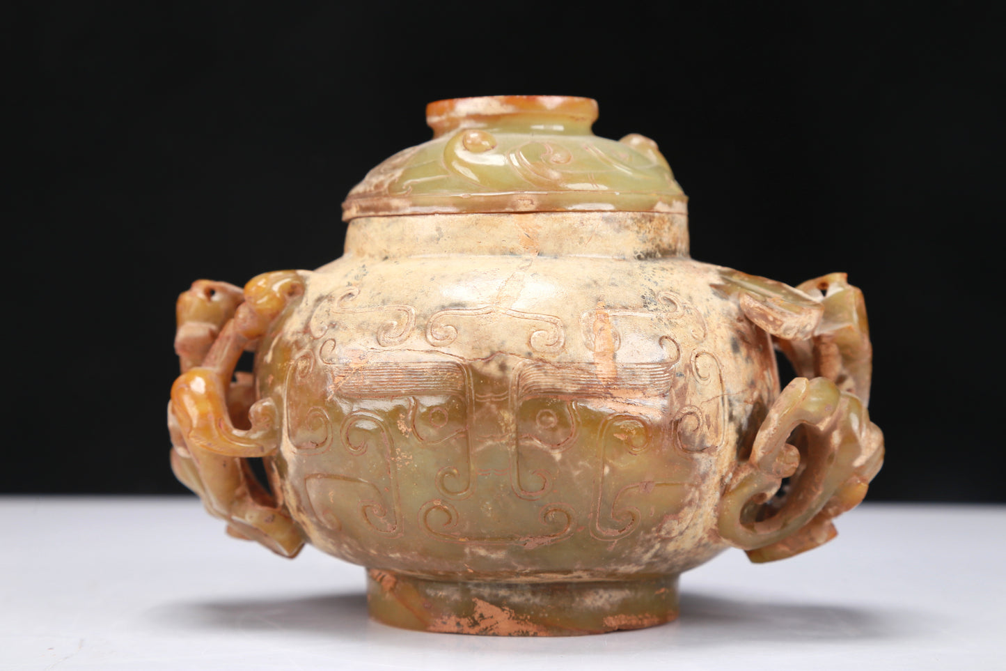 An Archaic Yellow Jade 'Auspicious Beast' Jar