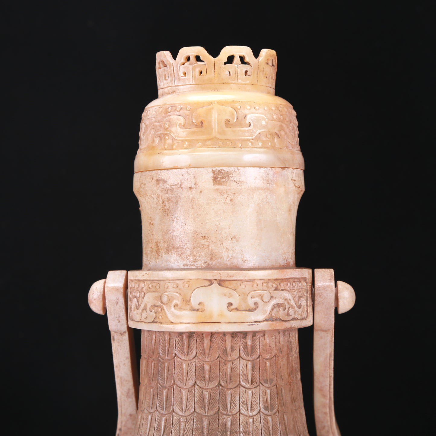 An Archaic White Jade 'Animal Mask' Vase With An Overhead Handle