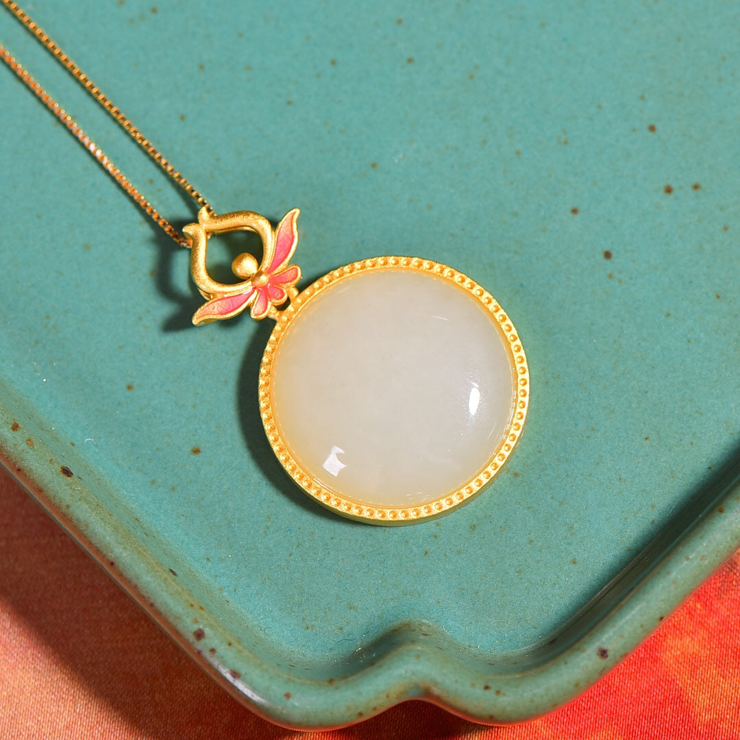 Gilt silver and Hetian jade enamel round egg pendant