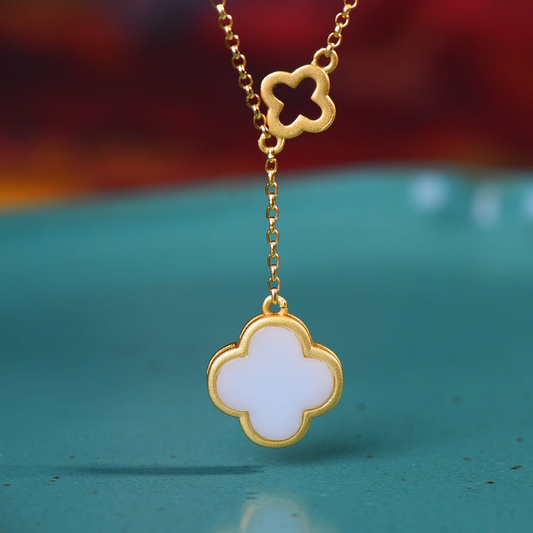 Gilt silver inlaid Hetian jade four-leaf clover pendant