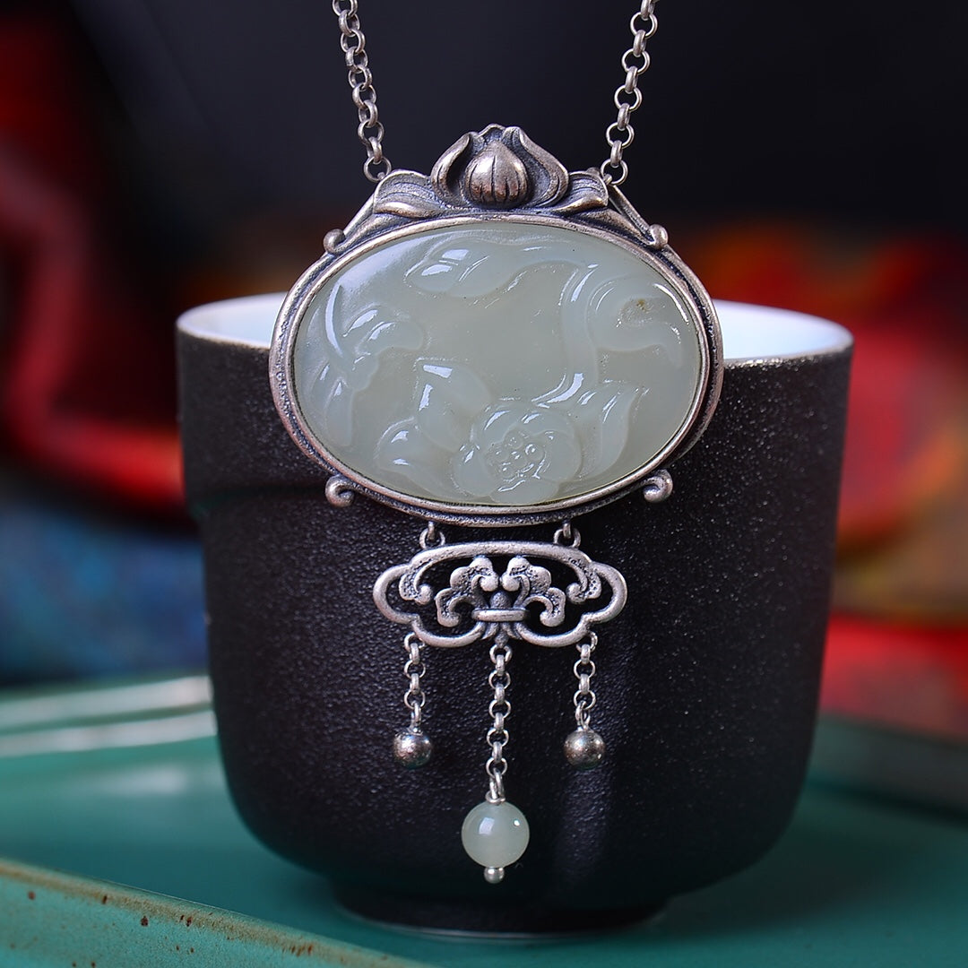 Silver inlaid Hetian jade lotus pendant