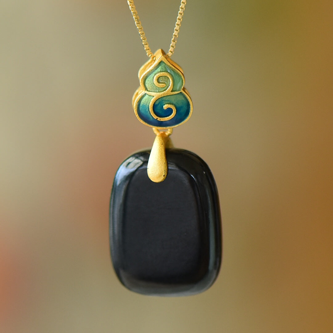 Gilt silver and Hetian ink jade enamel Ping An brand pendant