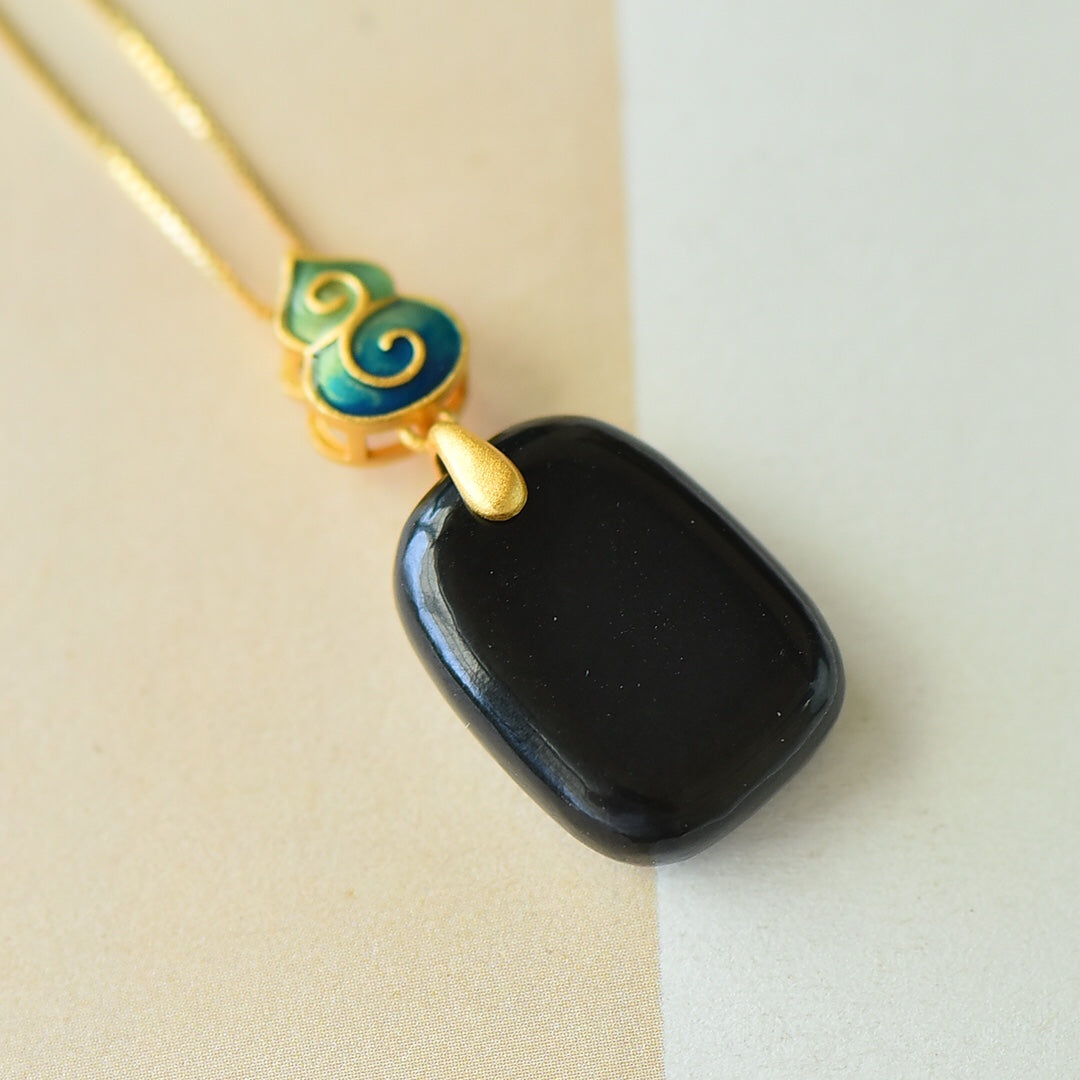 Gilt silver and Hetian ink jade enamel Ping An brand pendant