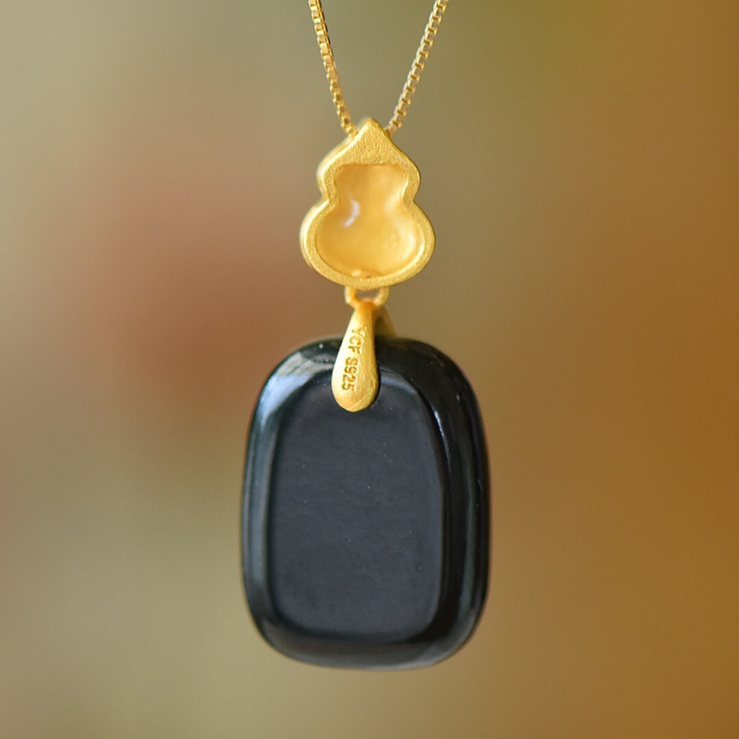 Gilt silver and Hetian ink jade enamel Ping An brand pendant