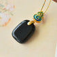 Gilt silver and Hetian ink jade enamel Ping An brand pendant