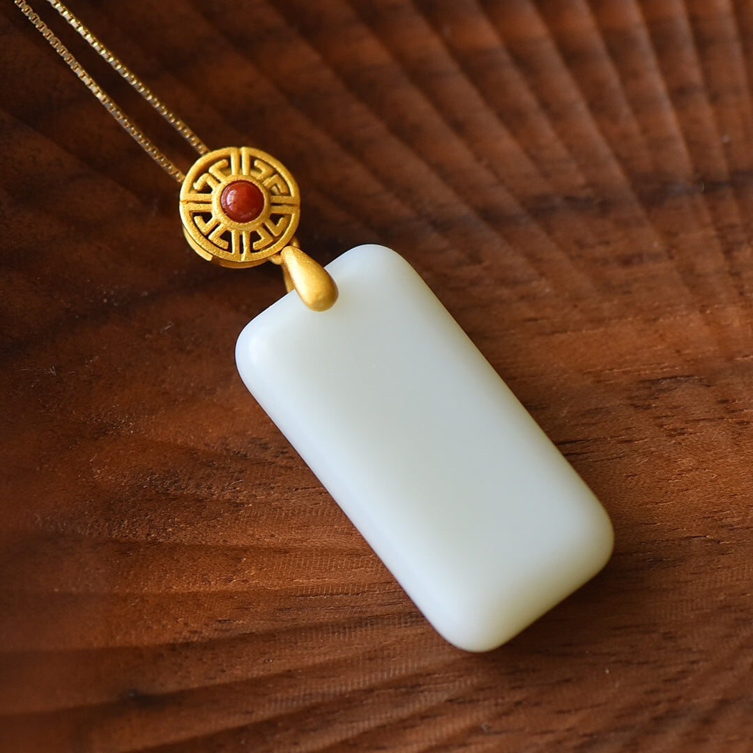 Gilt silver inlaid Hetian jade peace plate with southern red pendant