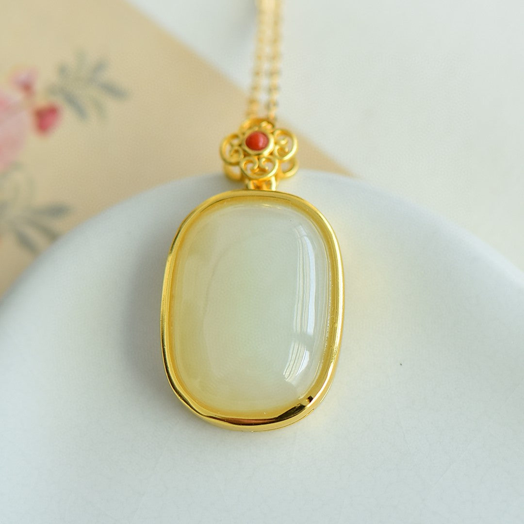 Gilt silver and Hetian jade egg noodles with southern red pendant