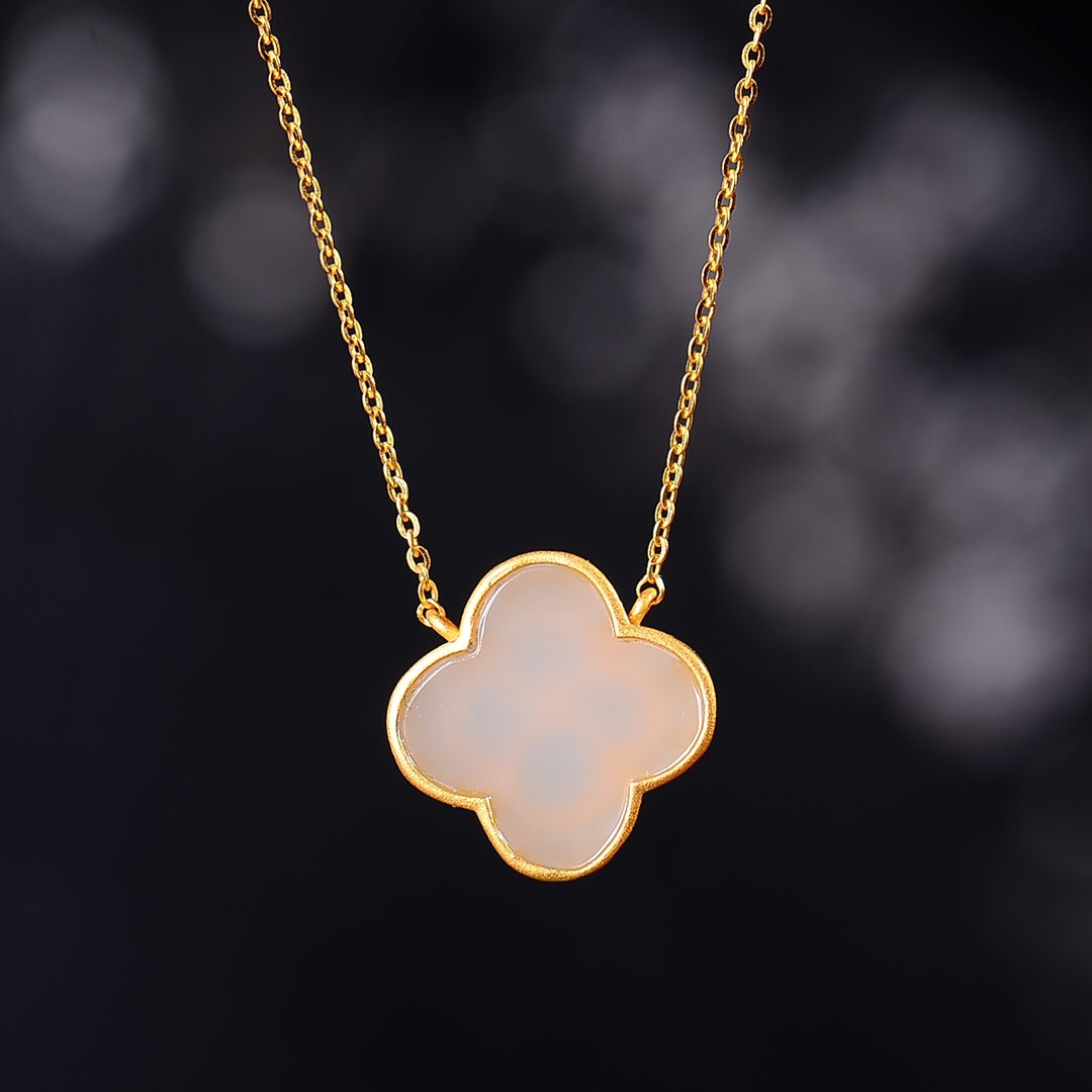 Gilt silver inlaid Hetian jade four-leaf clover pendant