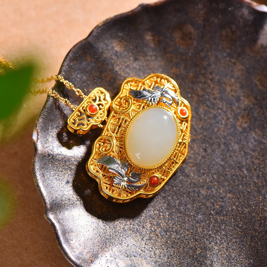 Gilt silver and Hetian jade egg-faced hollow sachet pendant