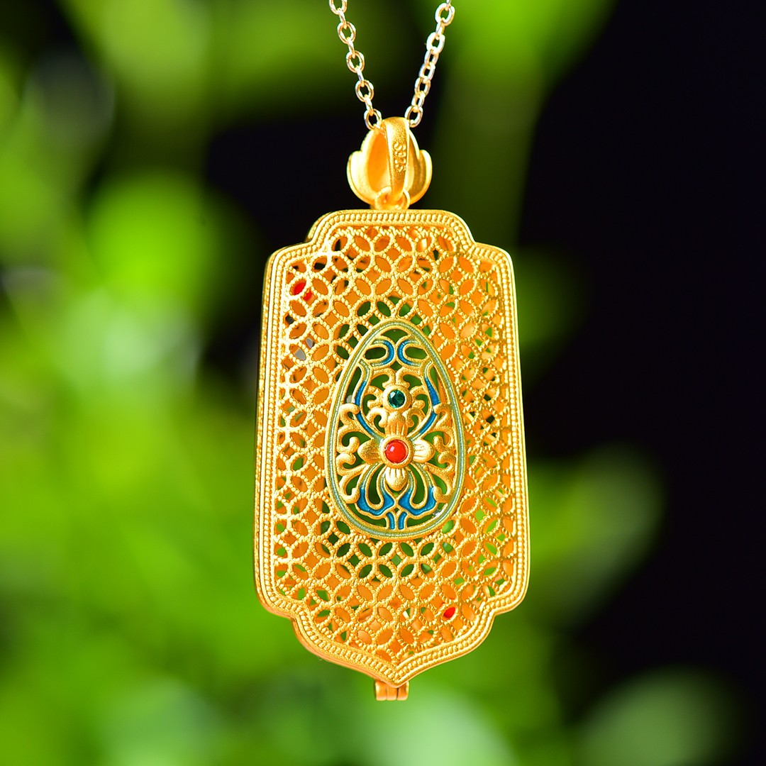 Gilt silver inlaid Hetian jasper hollow sachet pendant