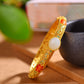 Silver gilt and Hetian jade enamel egg bracelet