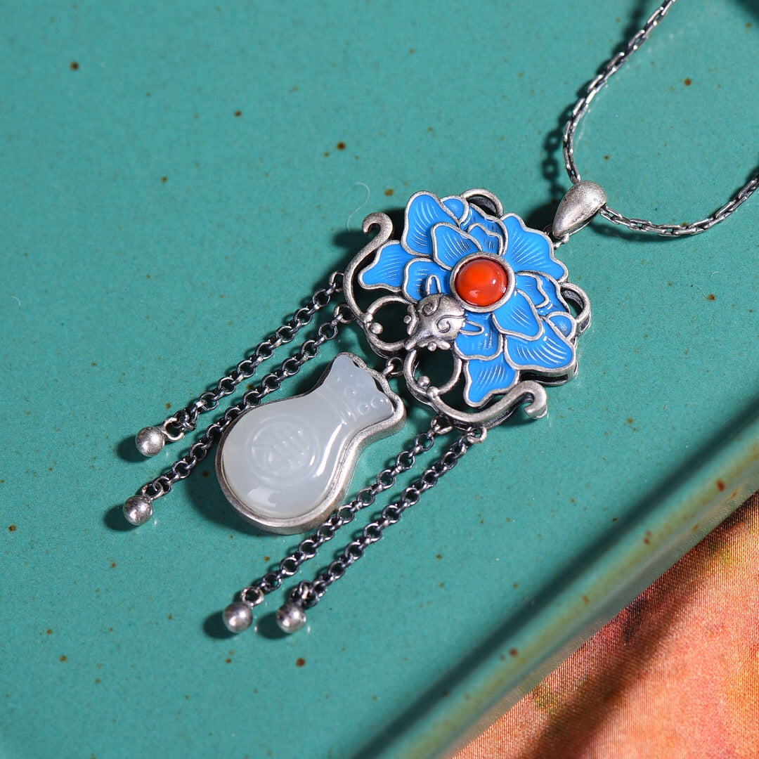 Silver inlaid Hetian jade with longevity characters and enamel with southern red pendant