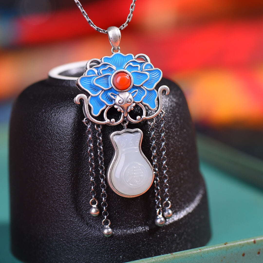 Silver inlaid Hetian jade with longevity characters and enamel with southern red pendant