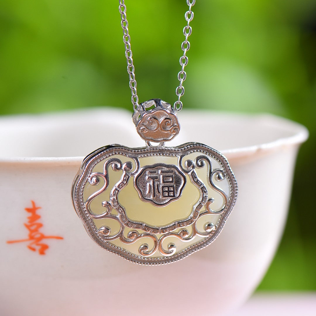 Silver inlaid Hetian jade Ruyi lock pendant