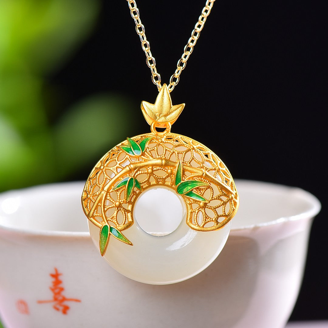 Gilt silver and Hetian jade enamel peace ring pendant