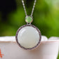 Silver inlaid Hetian jade pendant