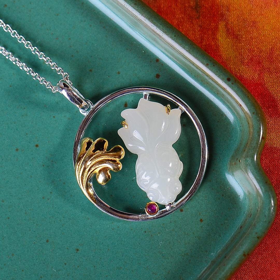 Silver inlaid Hetian jade fish pendant every year