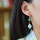 Silver inlaid Hetian jade enamel four-leaf clover earrings