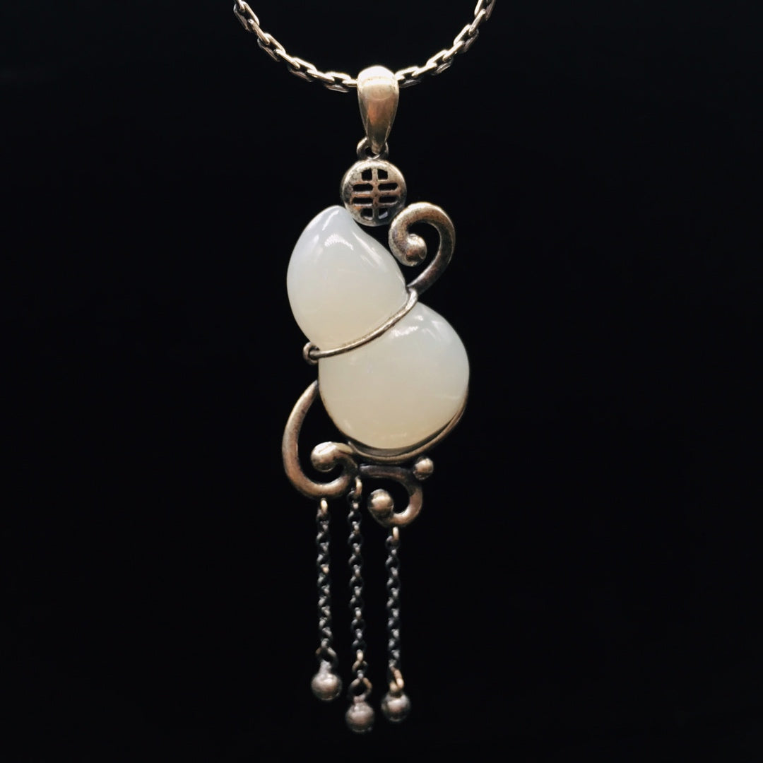 Silver inlaid Hetian jade pendant