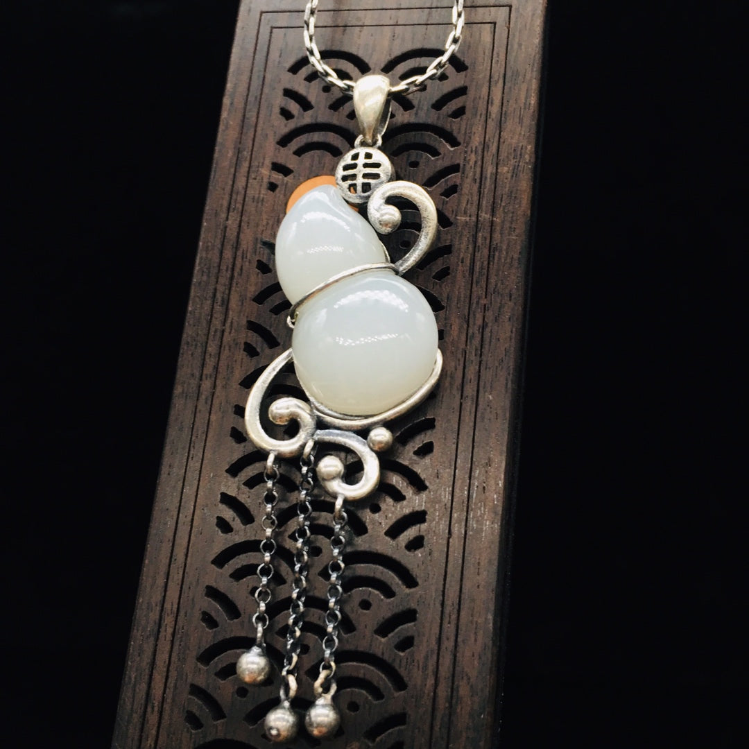 Silver inlaid Hetian jade pendant