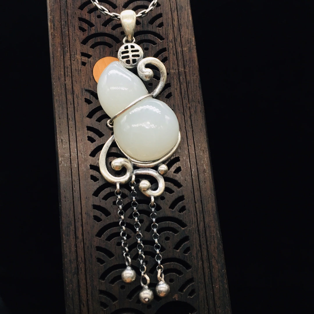 Silver inlaid Hetian jade pendant