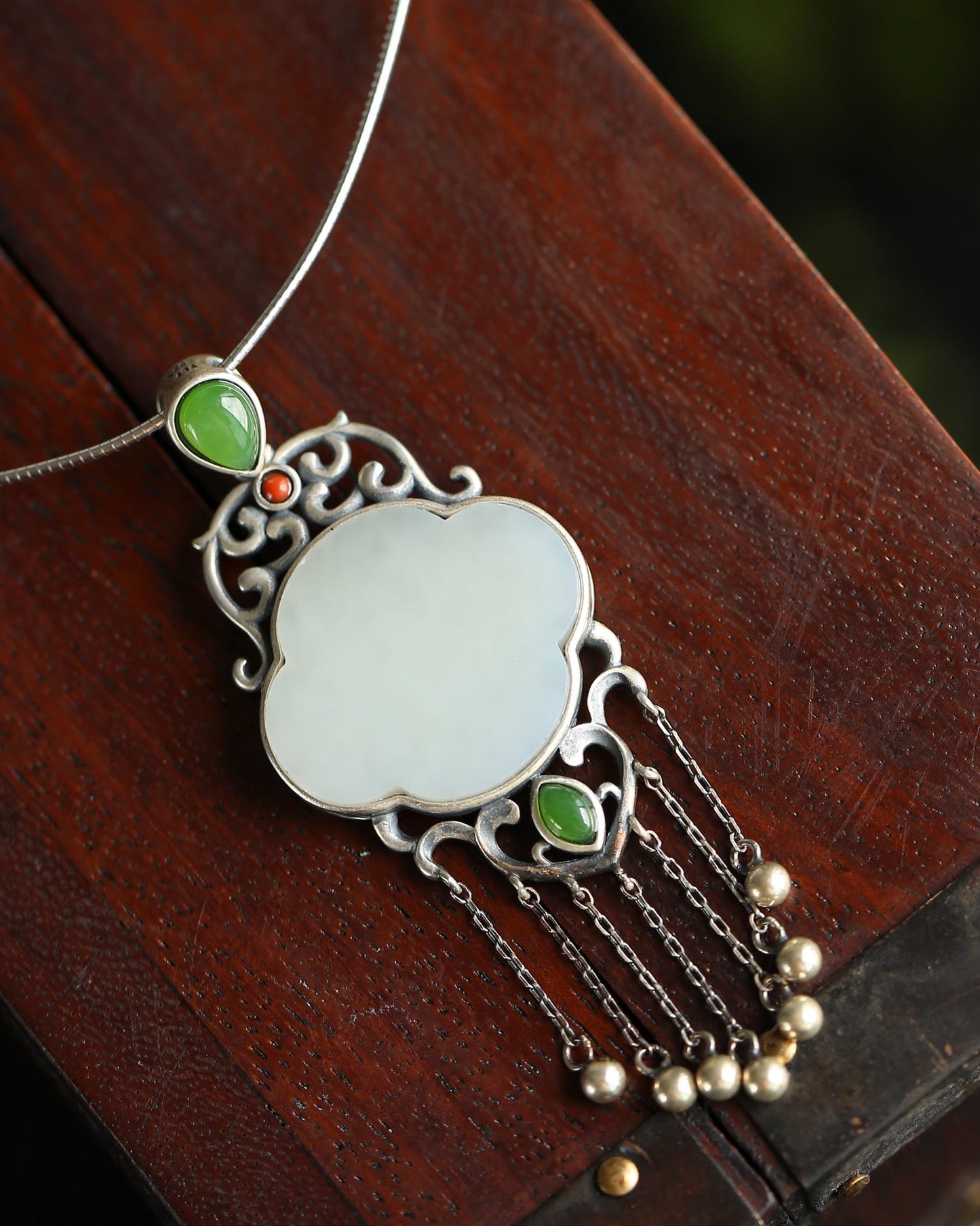 Silver inlaid Hetian jade pendant