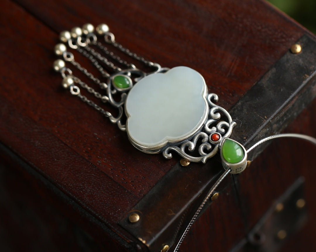 Silver inlaid Hetian jade pendant