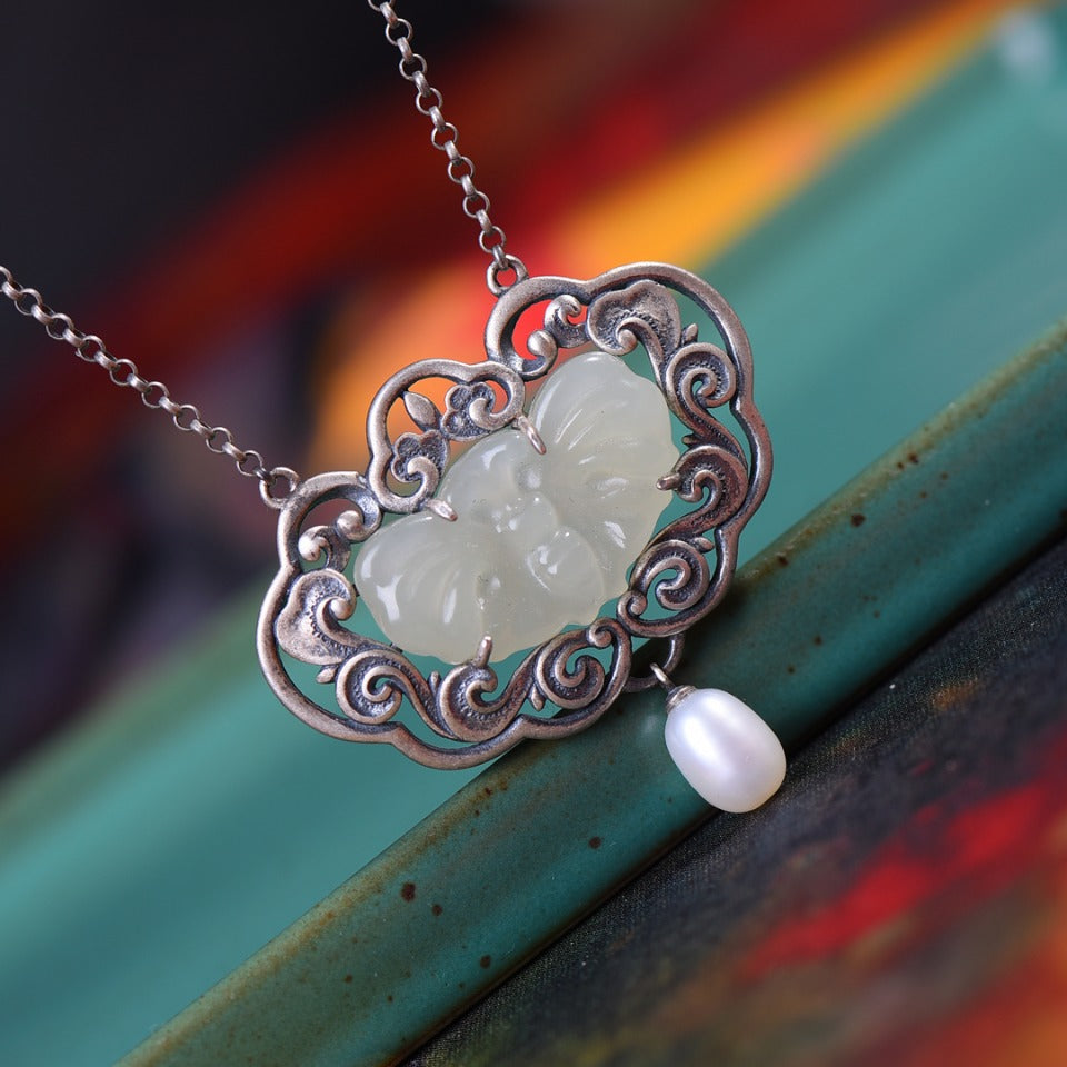 Silver inlaid Hetian jade pendant