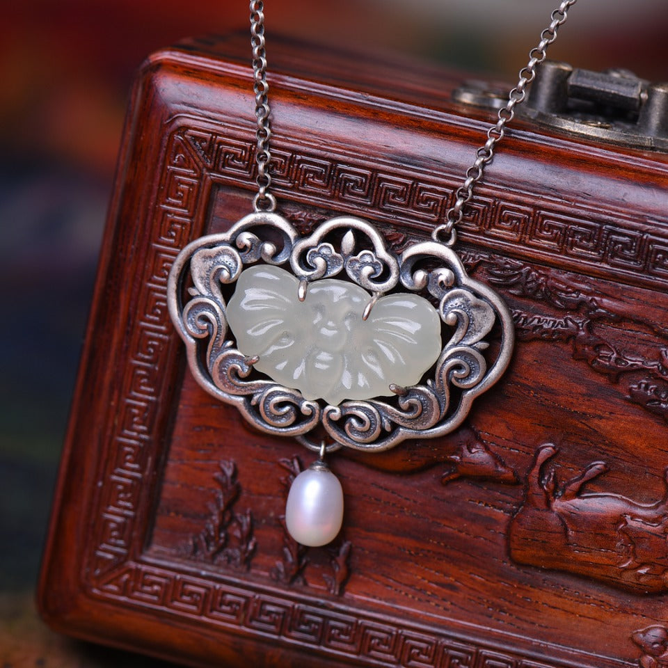 Silver inlaid Hetian jade pendant