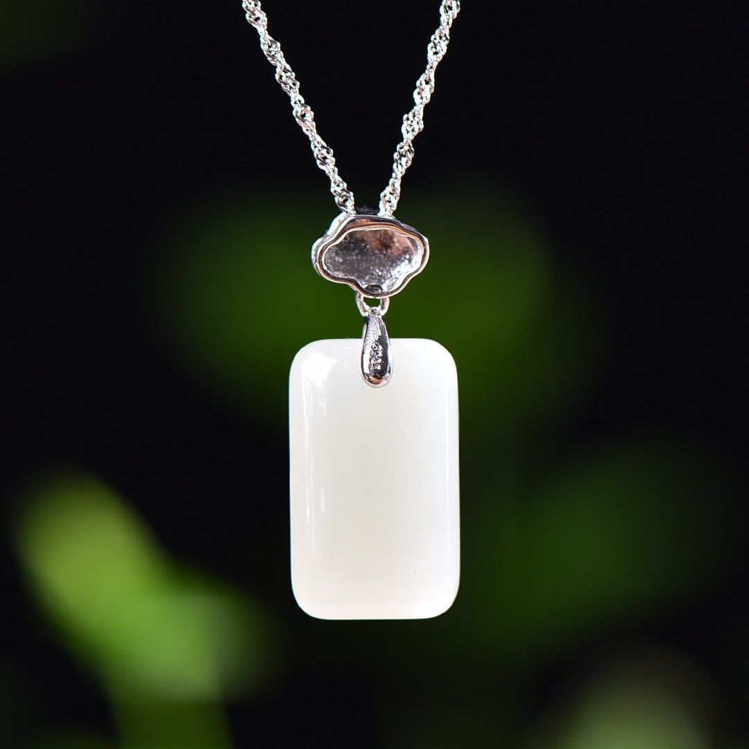 Silver inlaid Hetian jade pendant